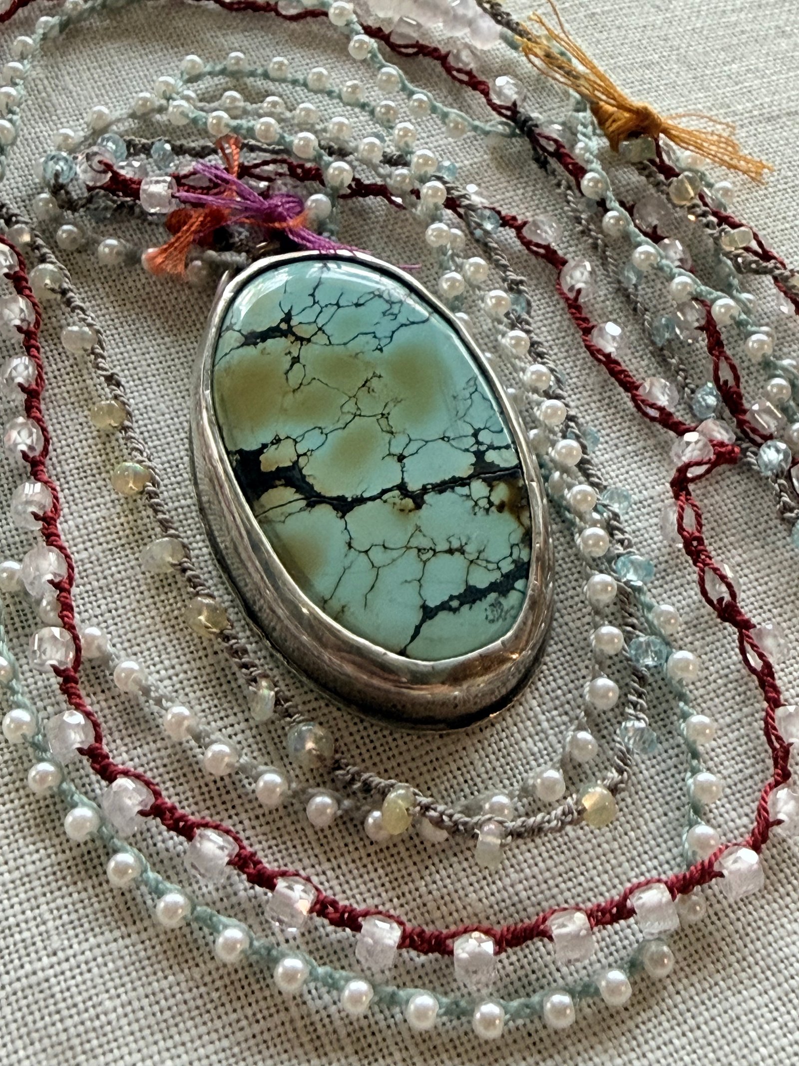 Blue-green gemstone statement necklace with freshwater pearls and a silver frame